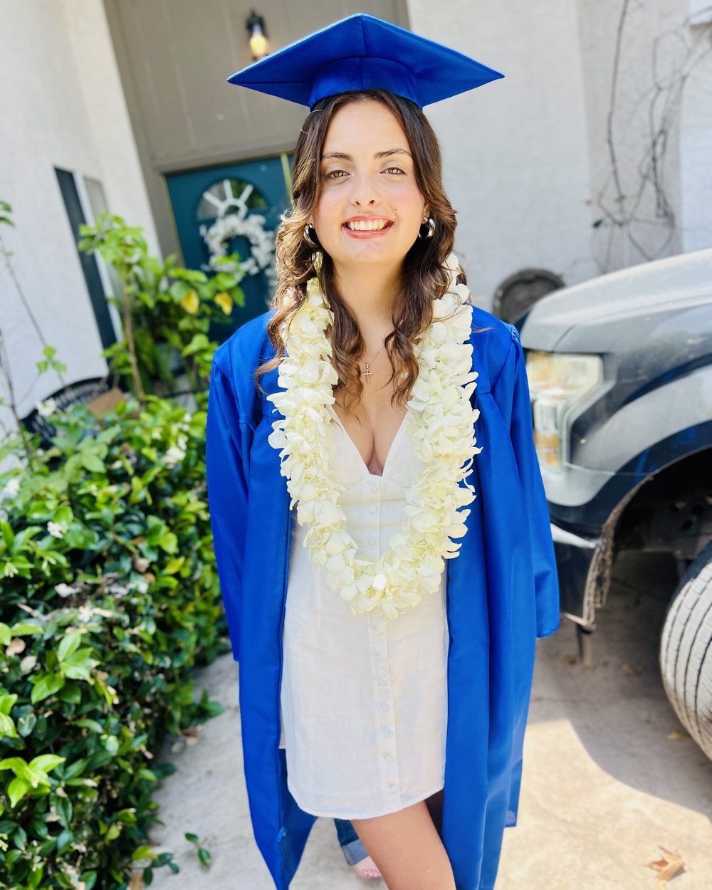 Now: Penny in her graduation cap and gown.